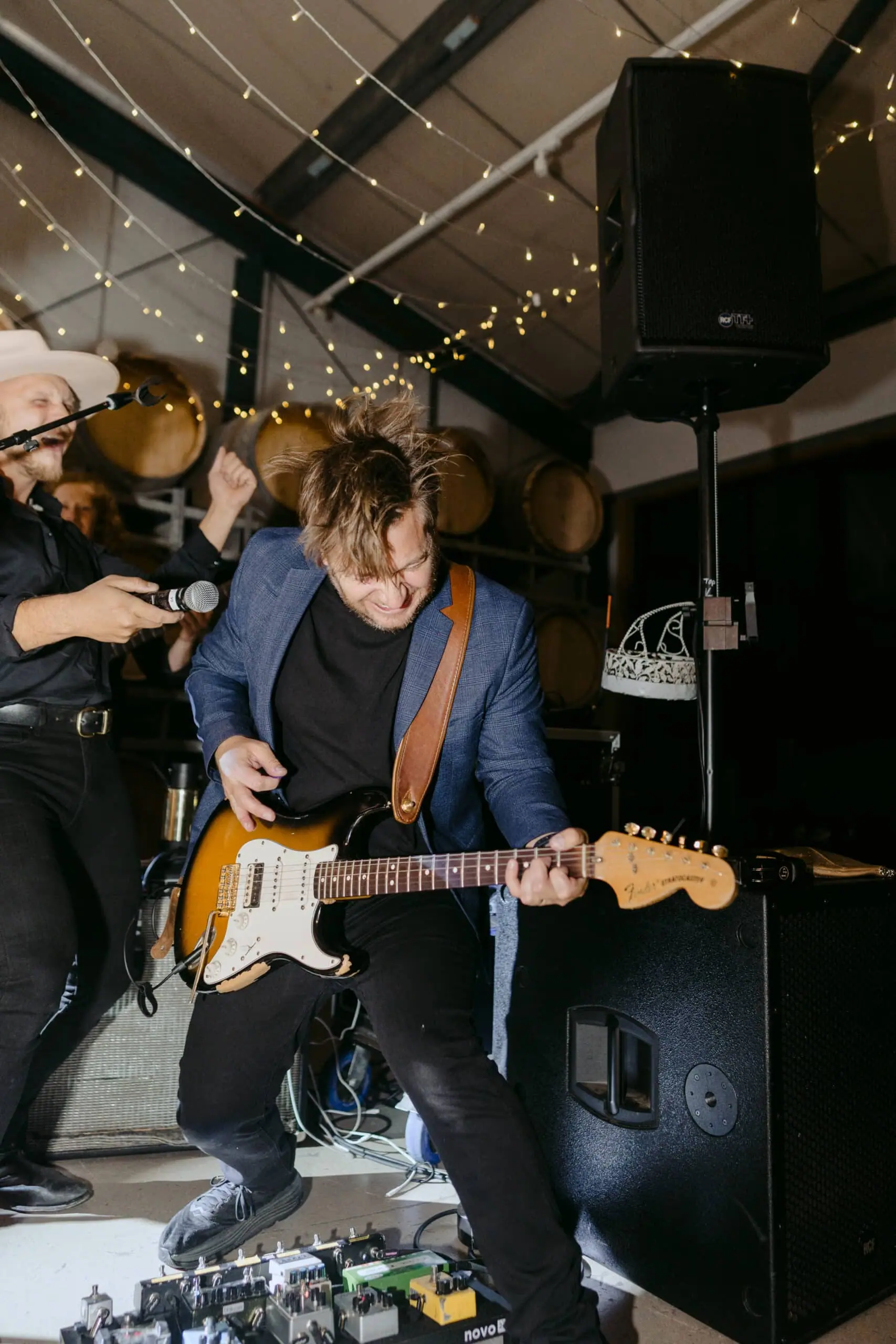 A wedding guitarist mid-solo with the band