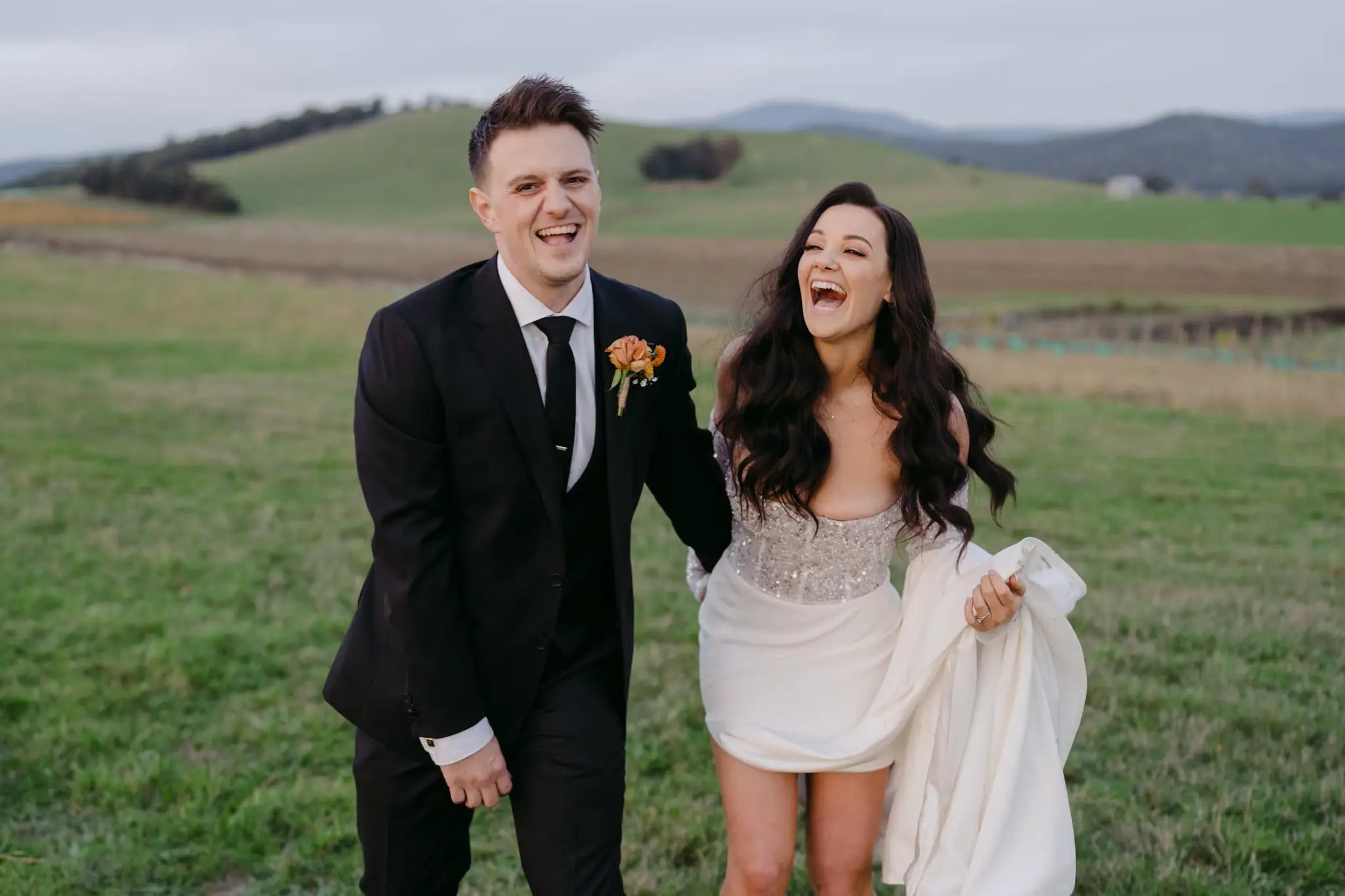 Tegan and Brennan laughing together on their wedding day