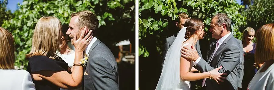 Two photographs of the couple greeting guests with kisses after the ceremony.