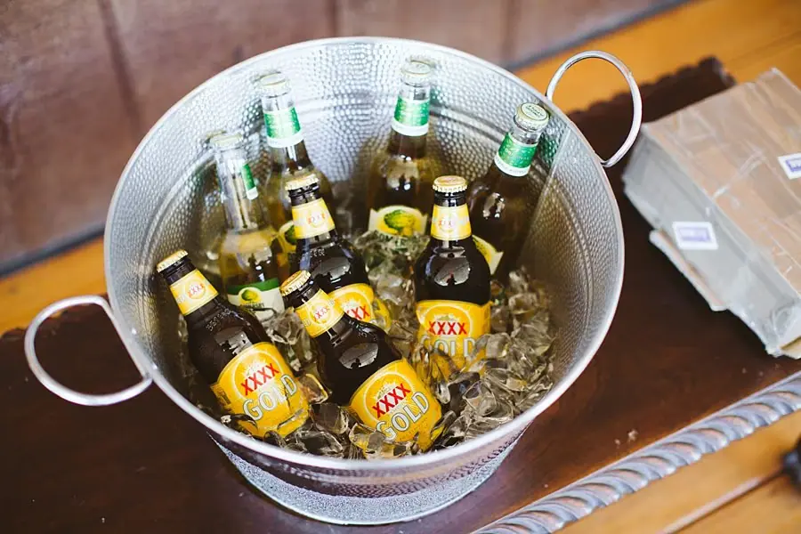 Bottled drinks chilling in a metal bucket