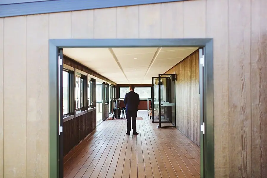 Groom waiting on the timber veranda
