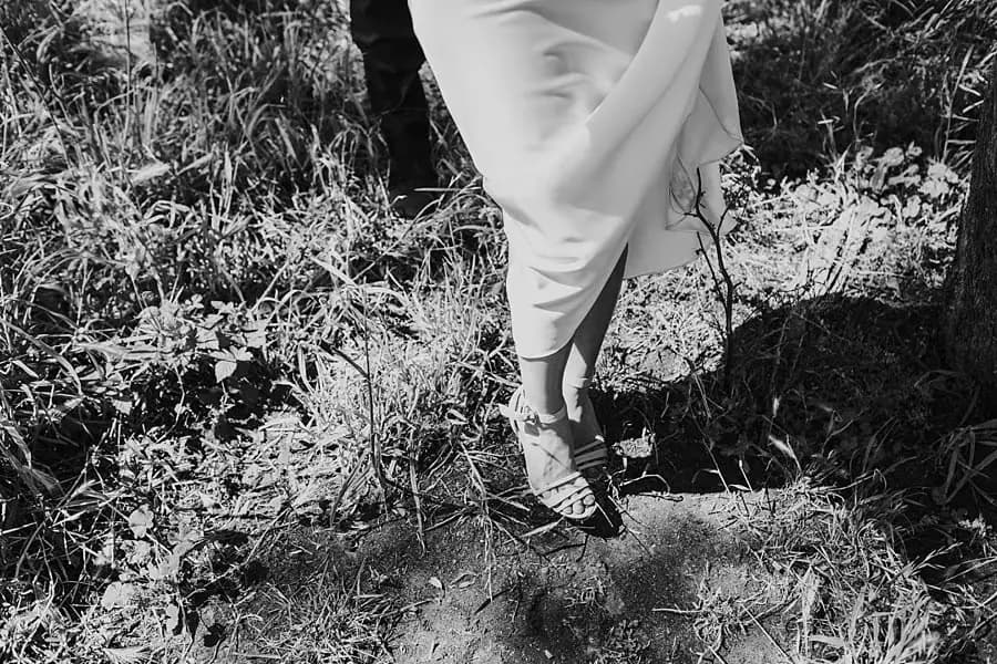 Close-up of the groom's shoes in the grass