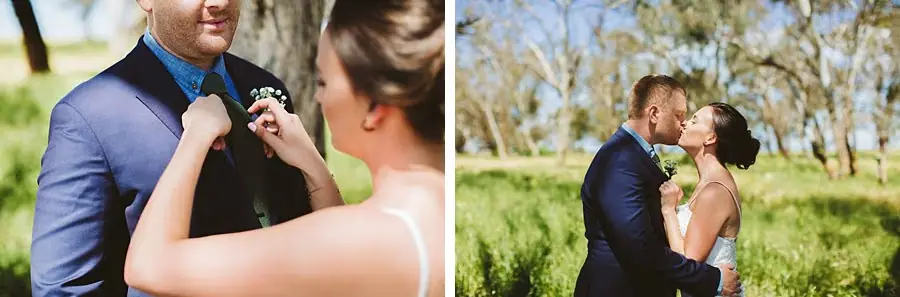Bride adjusting the groom's tie and kissing him