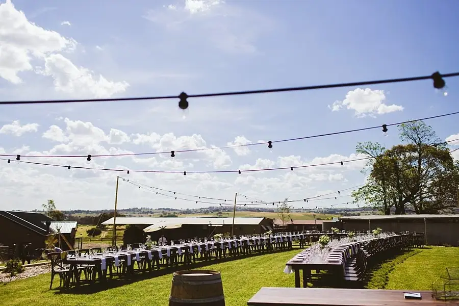 Festoon lights above the outdoor reception tables
