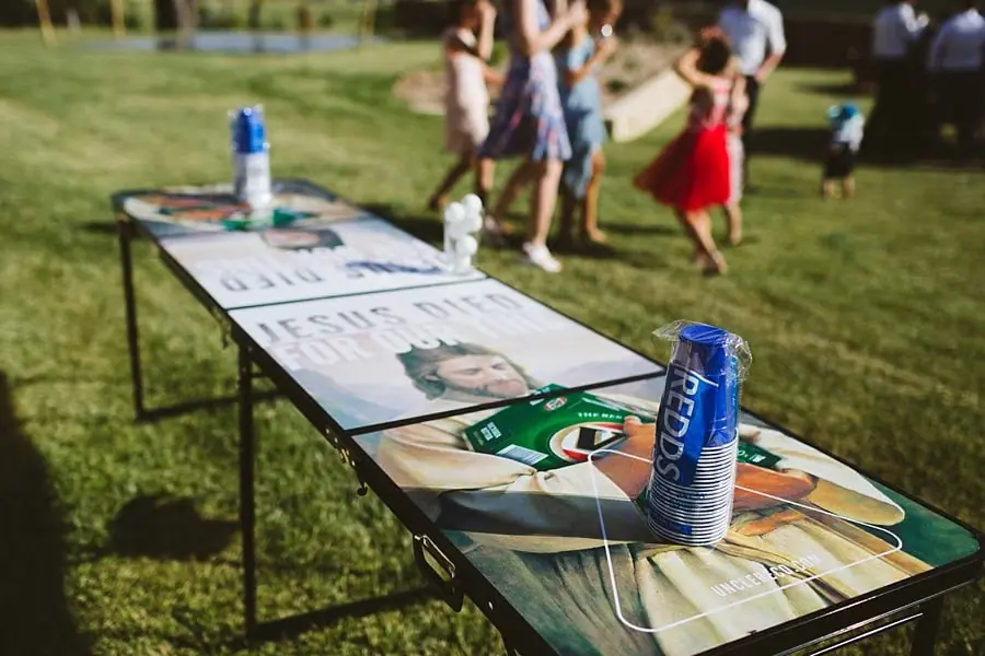 Lawn game table set up for wedding guests