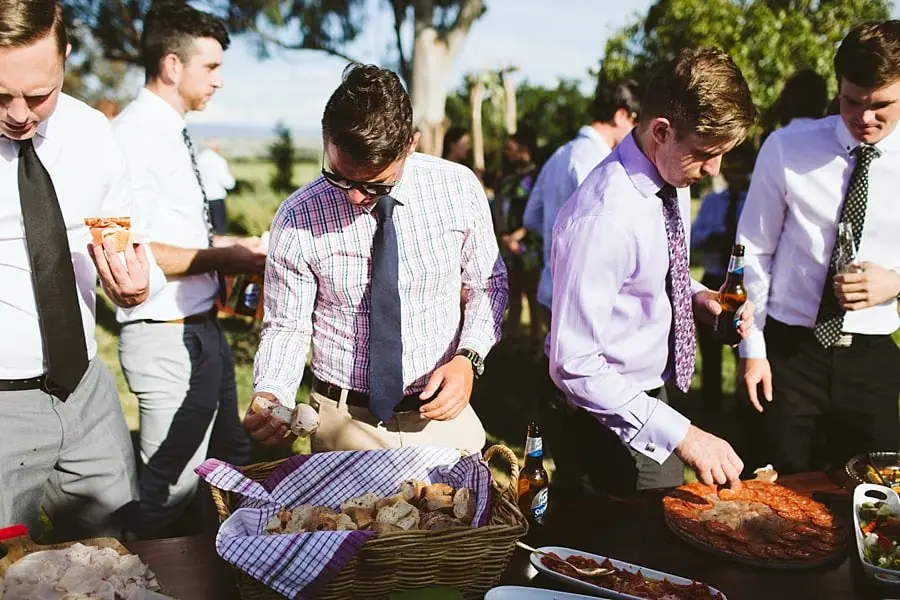 Guests gathered around a lawn game table