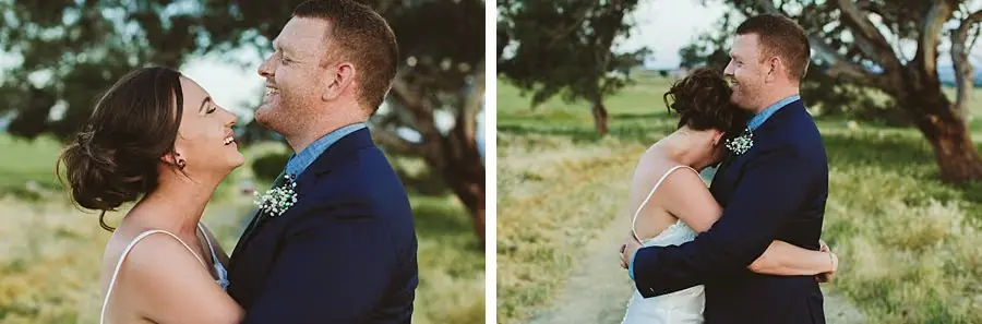 Couple kissing and embracing in the paddock