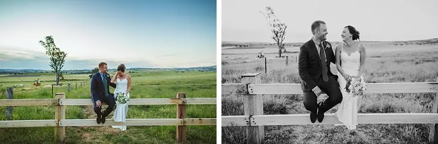 Couple posing and sitting beside a timber fence