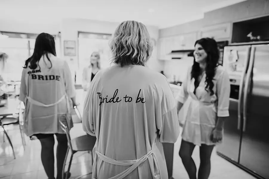 Black-and-white photograph of women in robes labeled bride and bride to be.