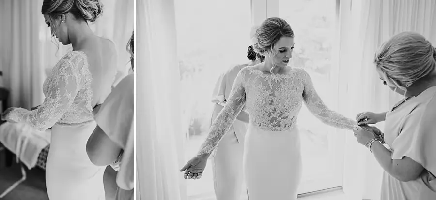 Two black-and-white photographs of companions helping fasten the bride's lace sleeves.