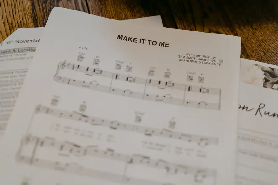 Printed sheet music resting on a wooden table