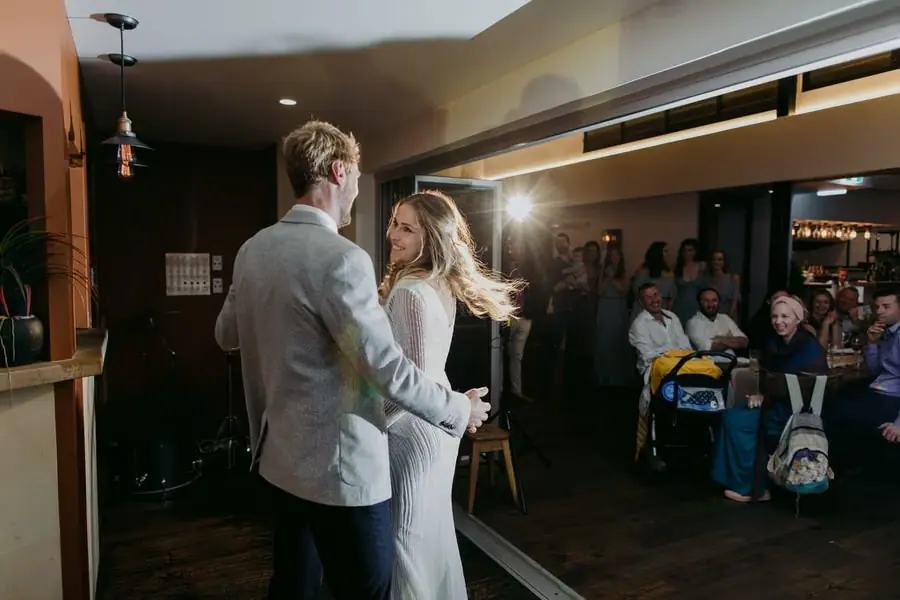 Bride and groom holding each other during their first dance