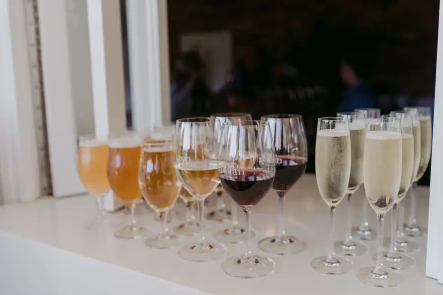 Wine and champagne glasses arranged beside an open serving window