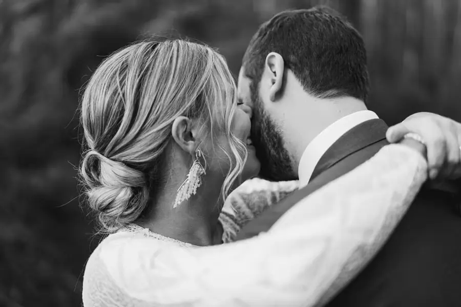 Black and white close-up of the couple leaning closely together