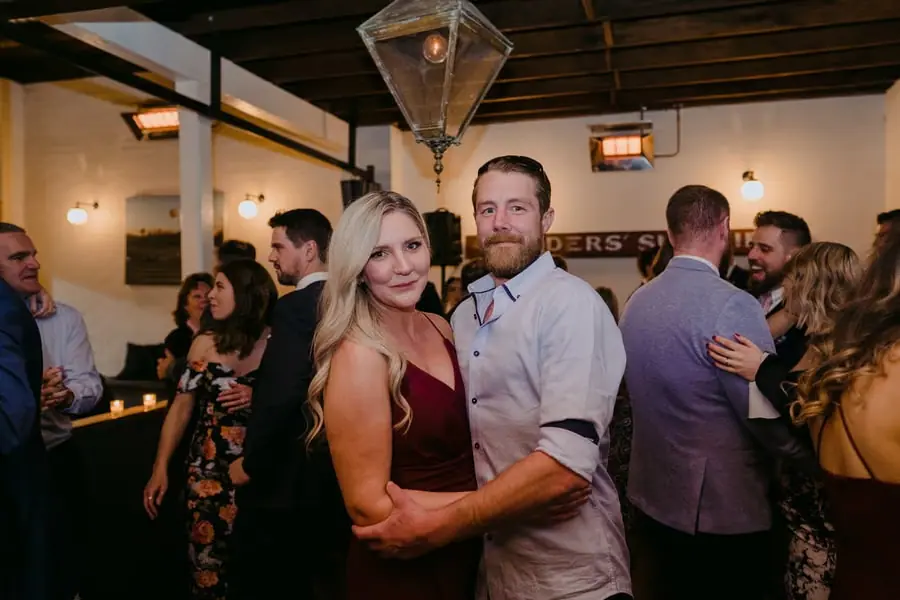 Two guests posing together on the dance floor