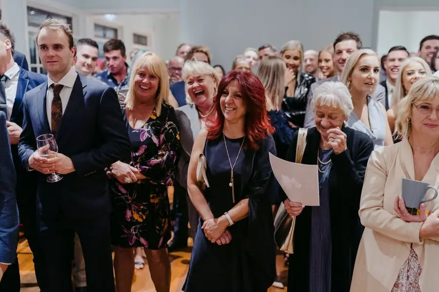 Guests laughing together in the reception room