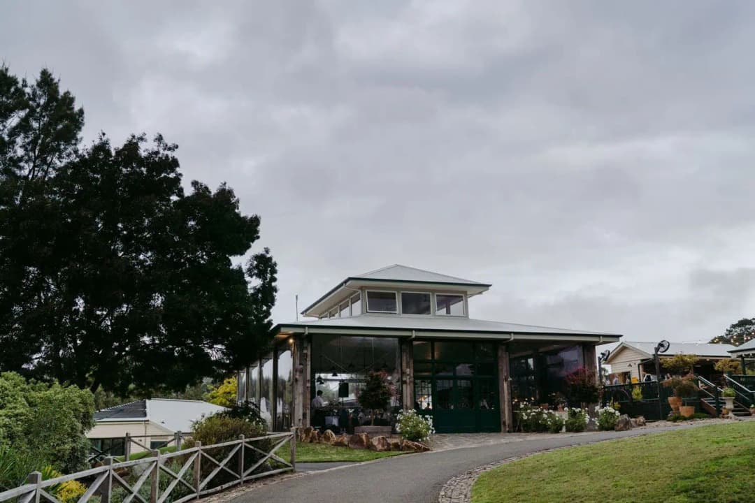Wedding venue building and garden beneath a cloudy evening sky