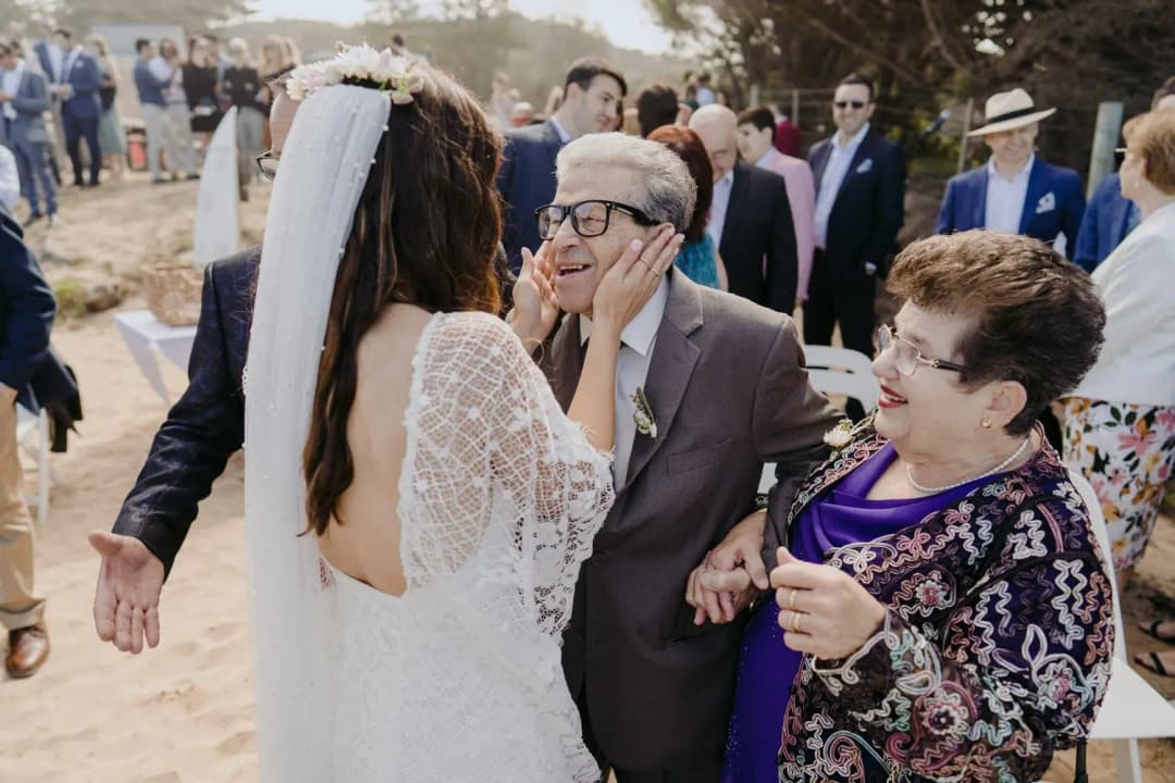 Bride greets older guests after the ceremony.