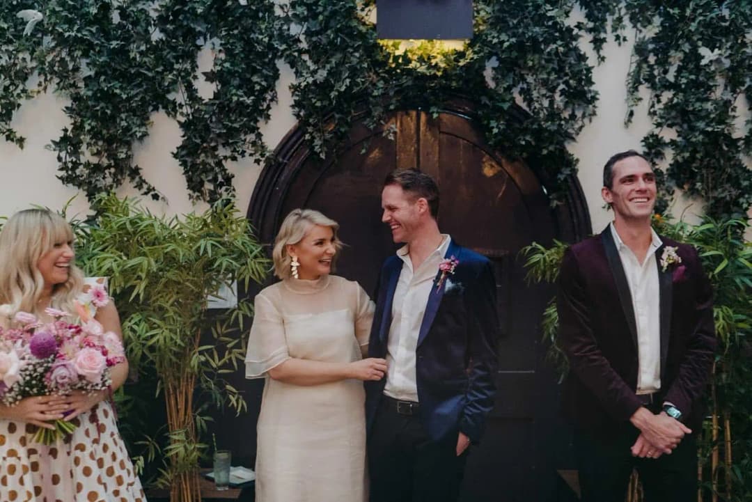 Bride and groom smiling at each other during the ceremony