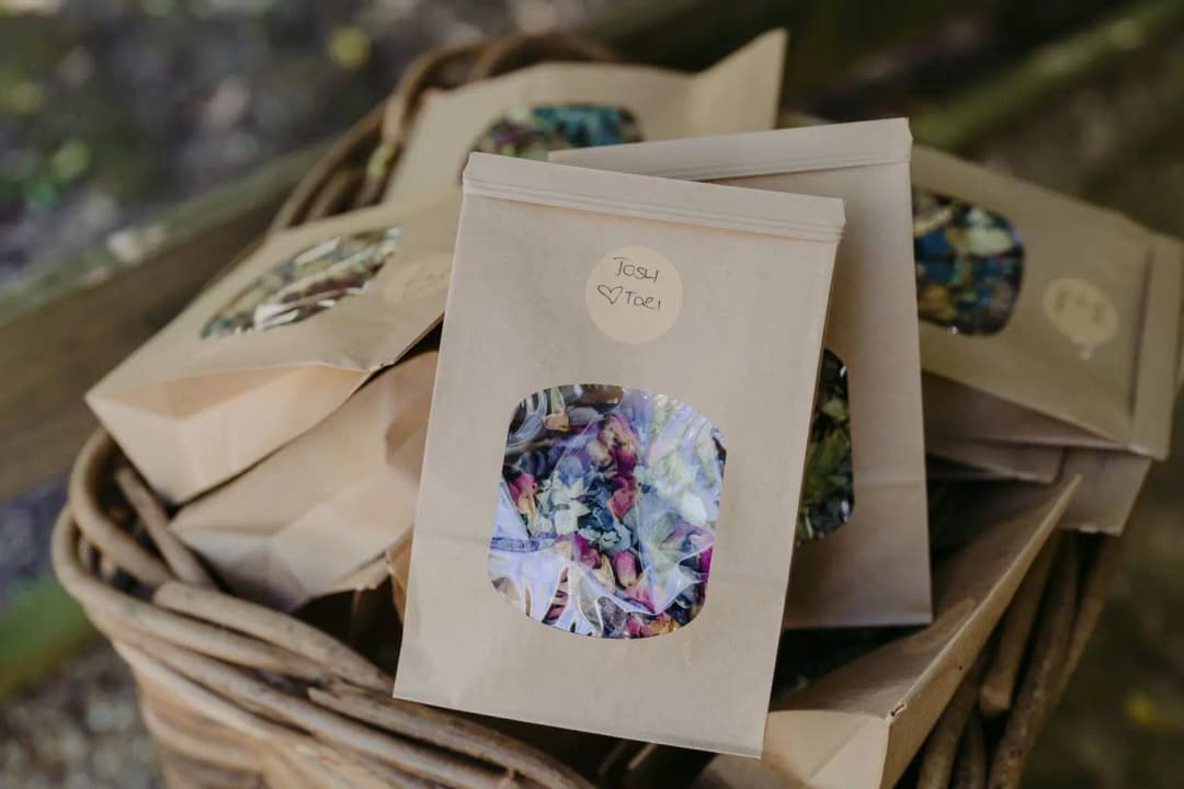 Paper bags of colourful confetti arranged in a wicker basket