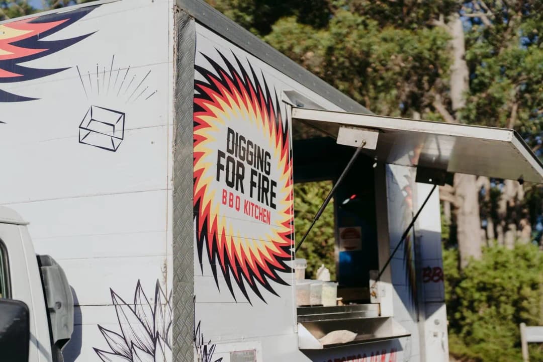 Colourful barbecue food truck parked beside the wedding reception