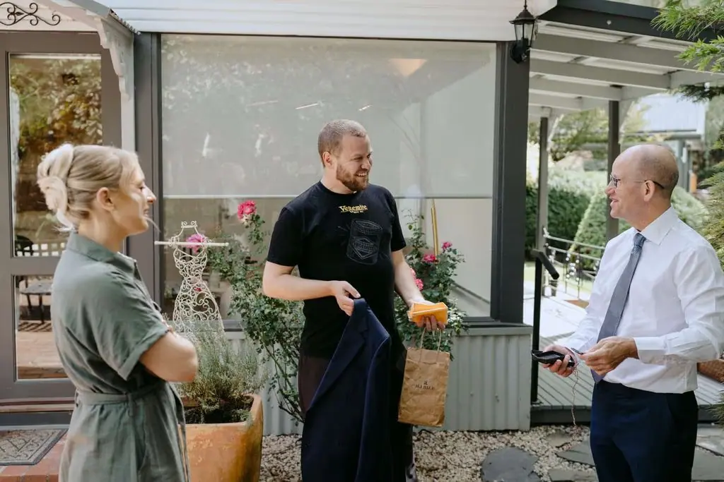 Guests chatting beside the patio doors