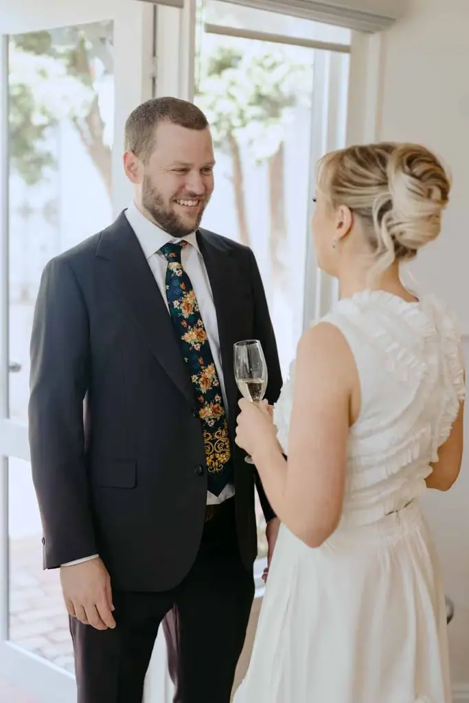 Couple smiling at each other during their first look
