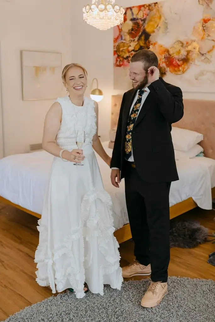 Couple smiling together in a bedroom