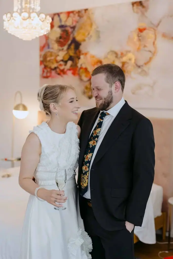Groom kissing the bride's head during their first look
