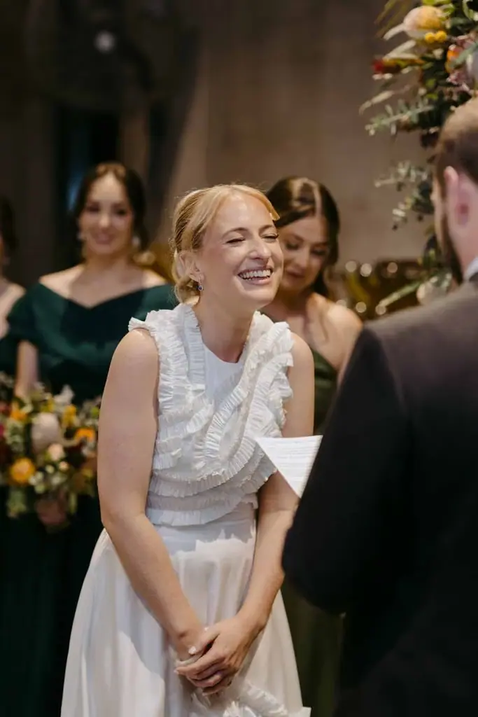 Bride reading her vows with bridesmaids behind her