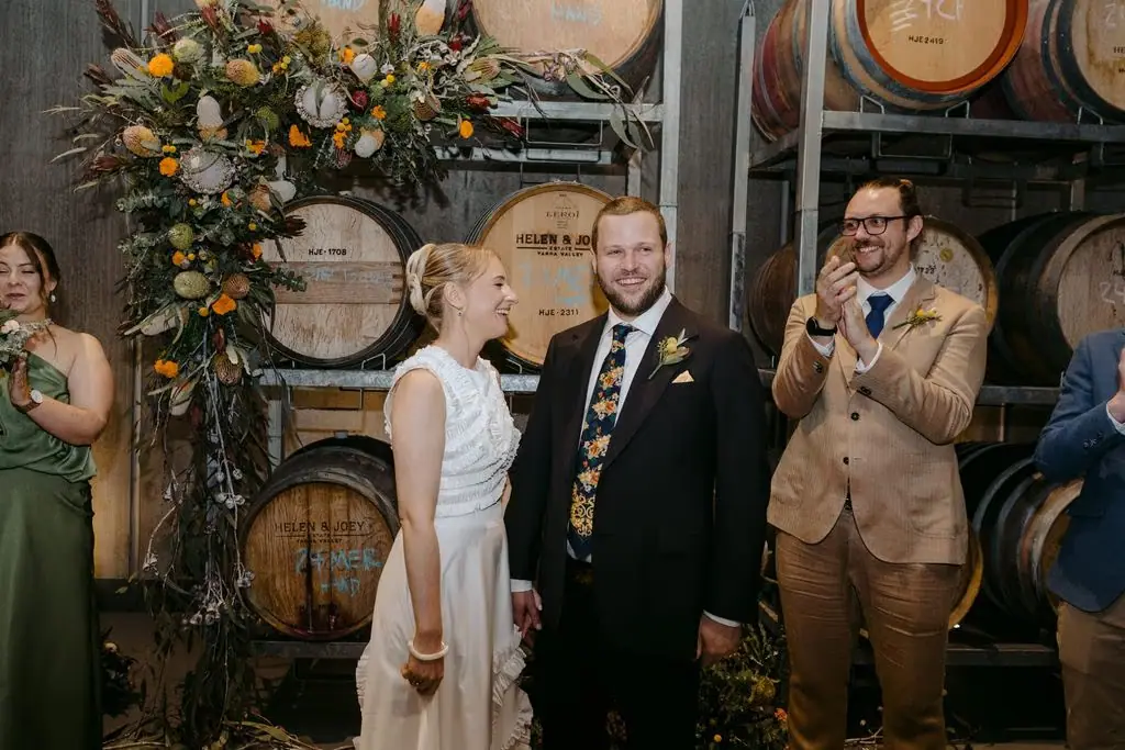 Couple celebrating as the groomsman cheers