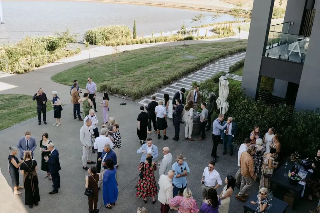 Guests gathered on the terrace beside the vineyard