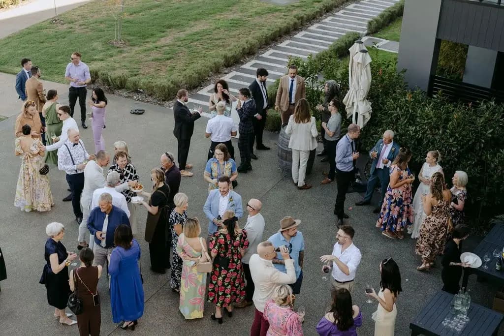 Guests mingling beside the venue steps