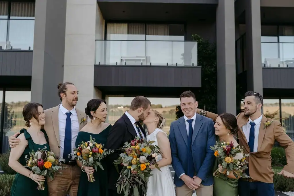 Wedding party celebrating outside the venue