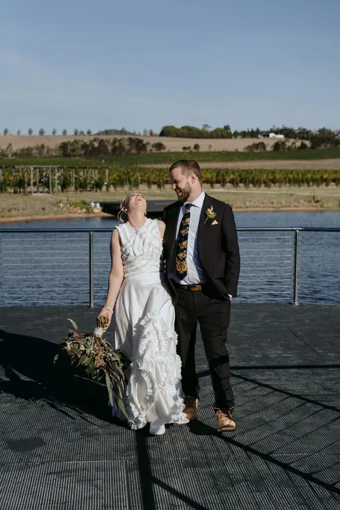 Couple smiling together beside the lake
