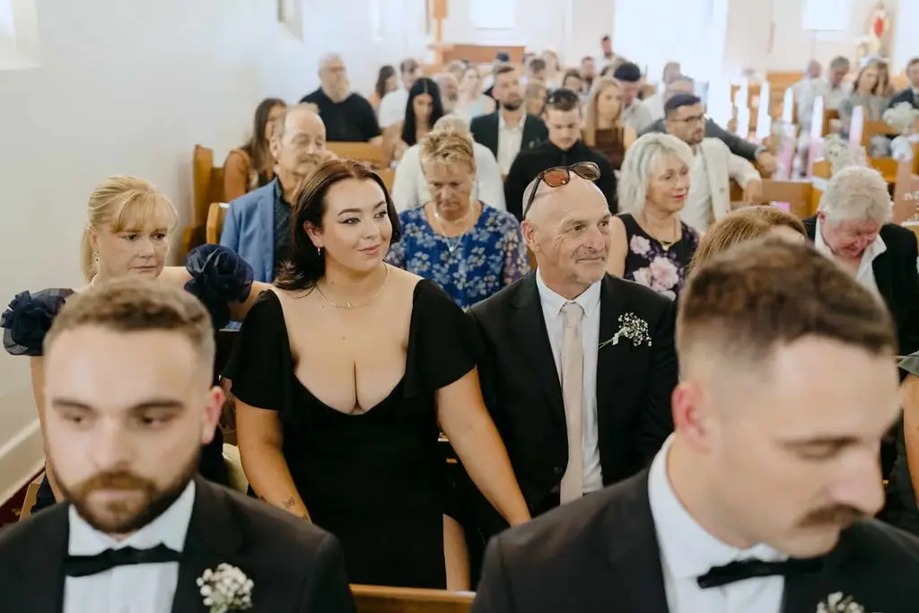 Guests walking through the church aisle