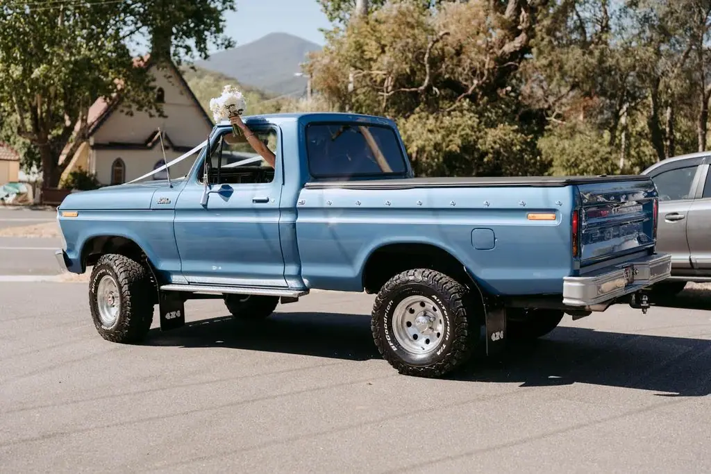 Blue pickup truck leaving the church