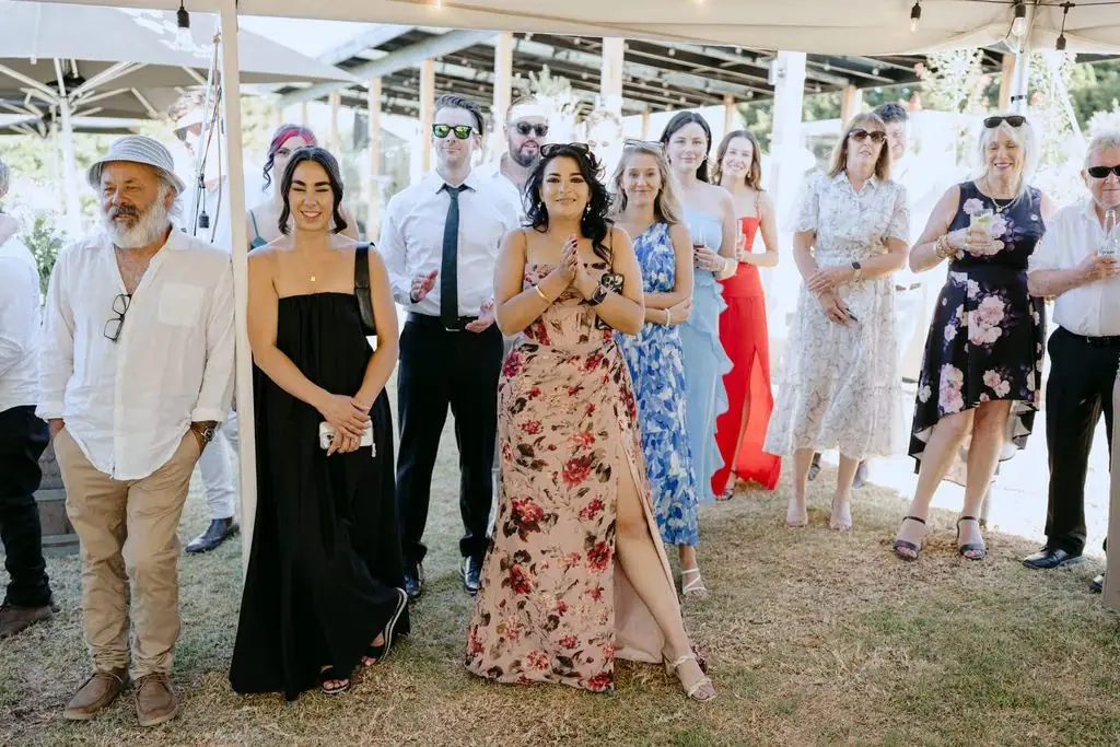 Guests watching the newlyweds at the reception