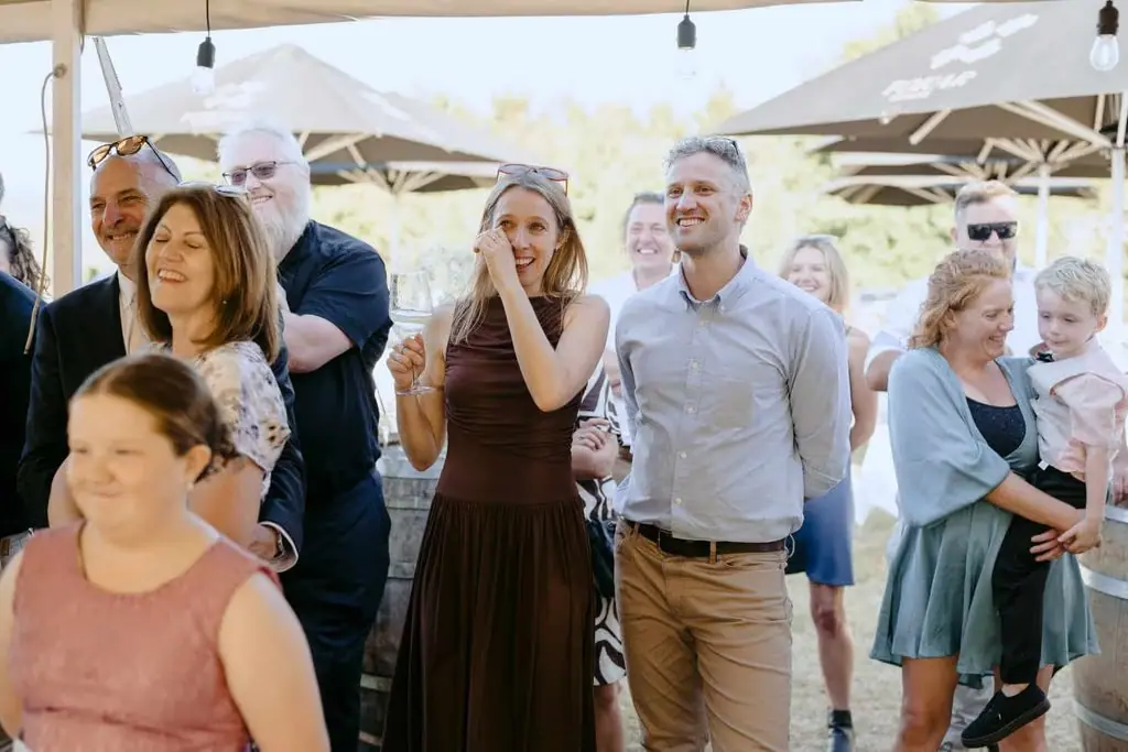 Guests watching from the edge of the marquee